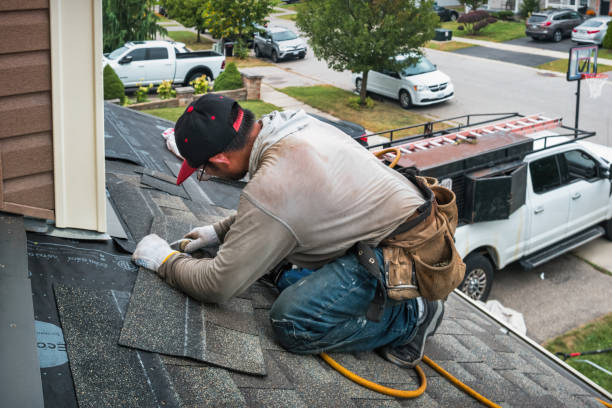 Professional Roofing technician working in Southold, NY